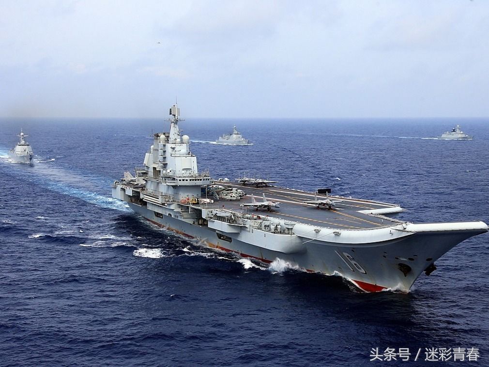 中国海军建军69周年 歼15首次挂实弹起降西太