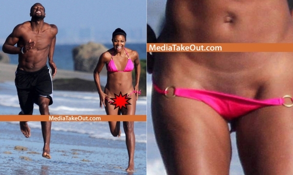 NBA球星韦德与女友沙滩奔跑 尤尼恩泳裤不慎掉落出糗瞬间。