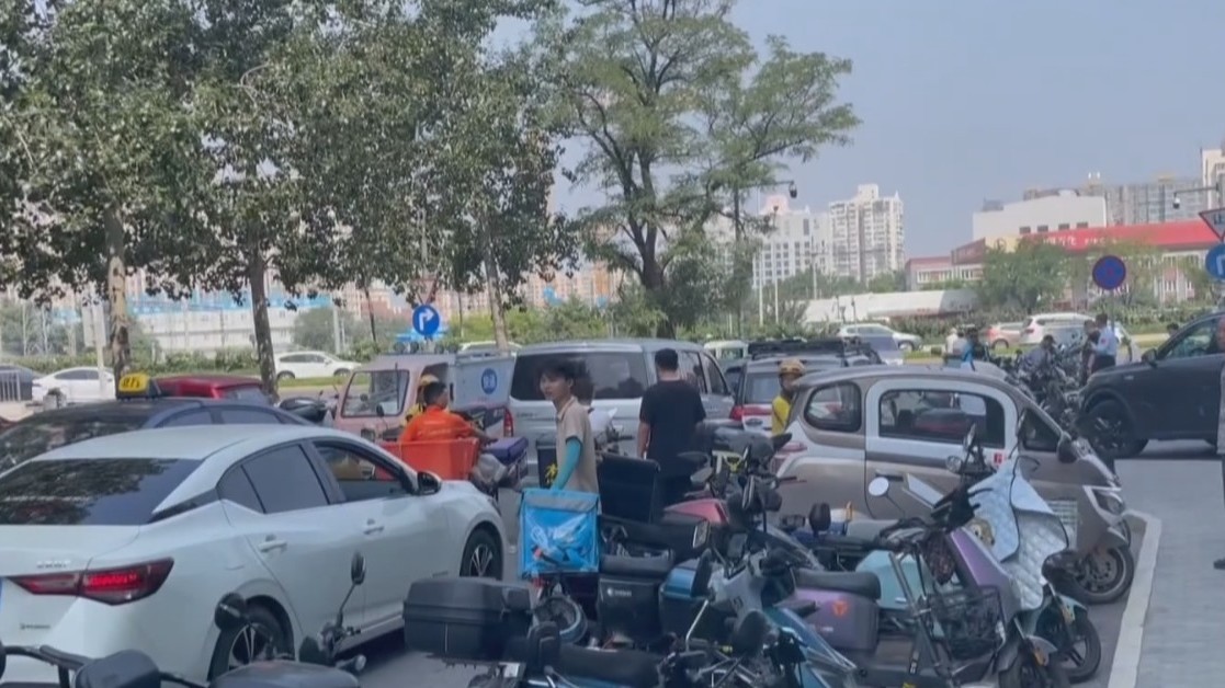 【社区零距离】丰台“快递小哥停车驿站”破解占路难题